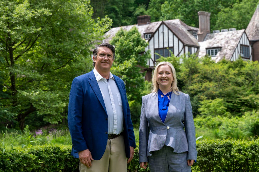 "Pitt-Greensburg President Robert Gregerson and Frederick Honors College Dean Nicola Foote in front of Lynch Hall"