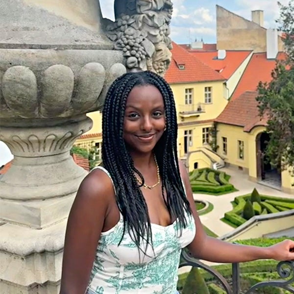 A student smiles while studying abroad.