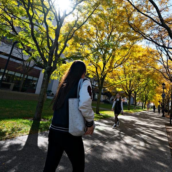 A student walks on campus.
