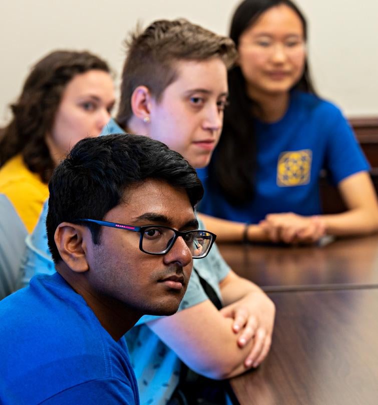 Honors students listen intently to a presenter.