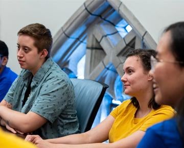 Students share a discussion at the Honors College.