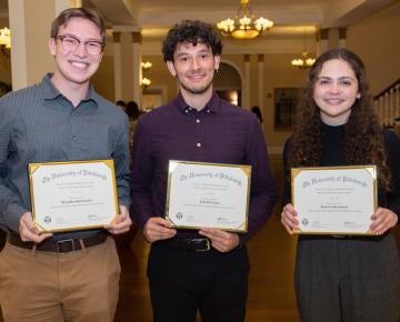 Three winners of the inaugural Voyager Scholarship hold their awards