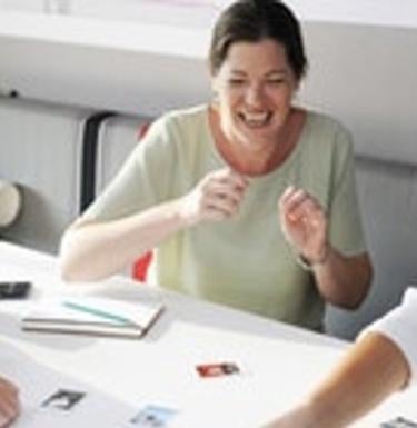 person sitting and laughing