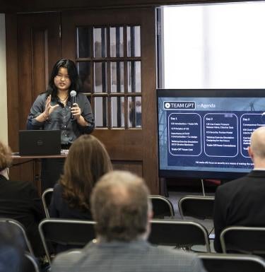 Isabella Hsia presents findings from the SHURE-Grid program to fellow students and researchers