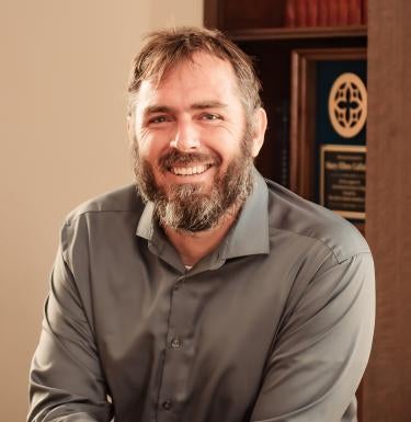 Headshot of scholar mentor Josh Cannon on the 36th floor of the Cathedral