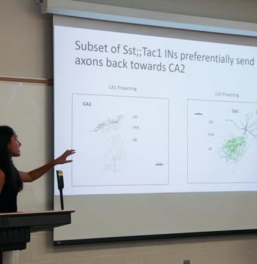 A student presenting their research