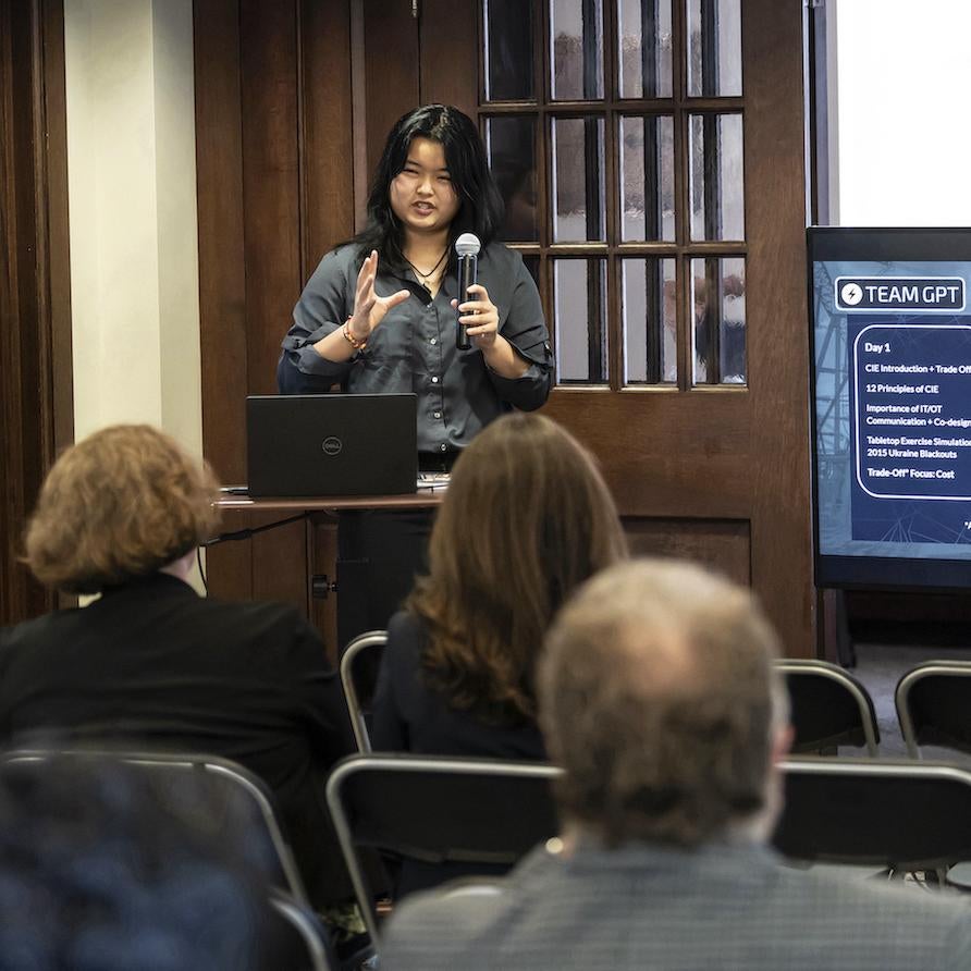 Isabella Hsia presents findings from the SHURE-Grid program to fellow students and researchers