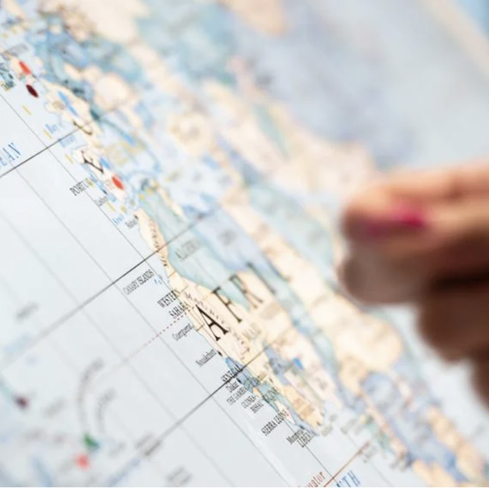 Hand point to map